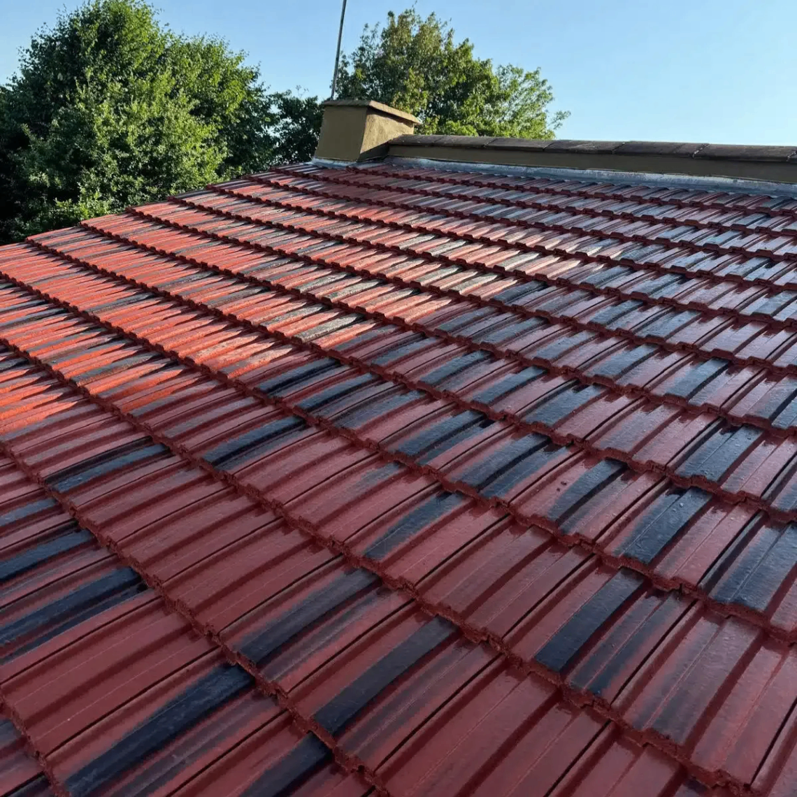 Red tiled roof replacement completed by Prestige Elite Roofing